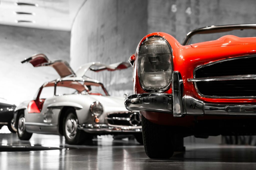 A vintage Mercedes-Benz photographed in a classic-car showroom setting