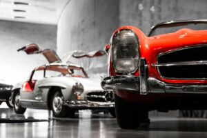 A vintage Mercedes-Benz photographed in a classic-car showroom setting
