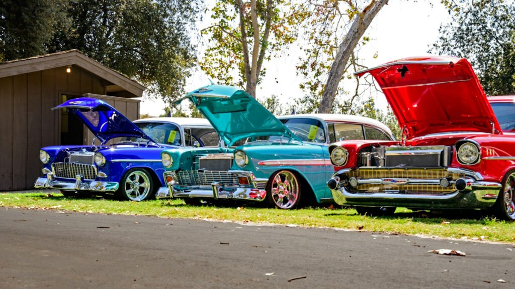 Rows of vintage cars displayed at an outdoor classic car show